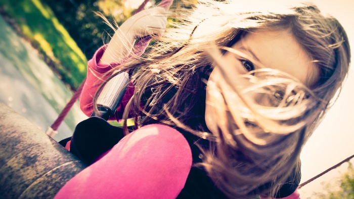 Little girl on a swing