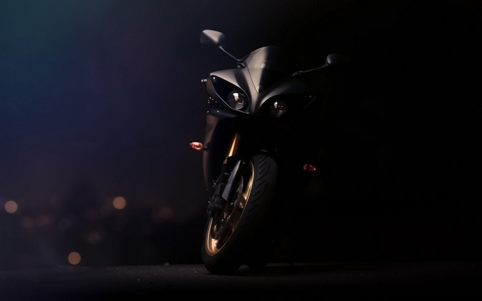 Black Yamaha YZF R1 motorcycle in the dark