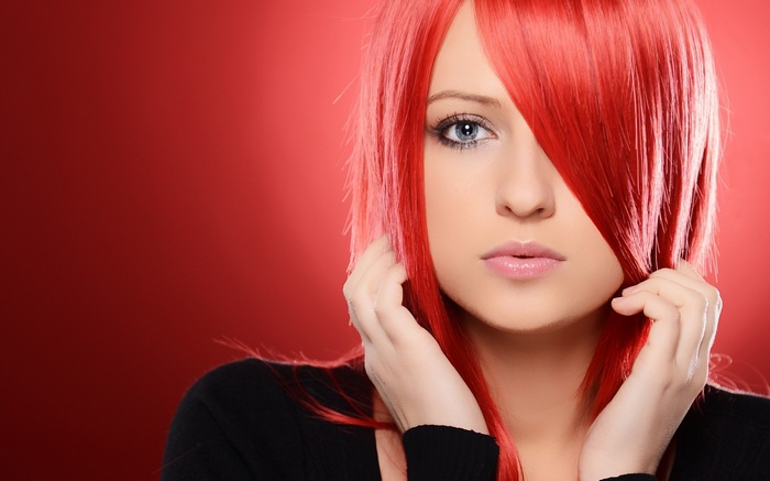 Woman with bright red hair and blue eyes