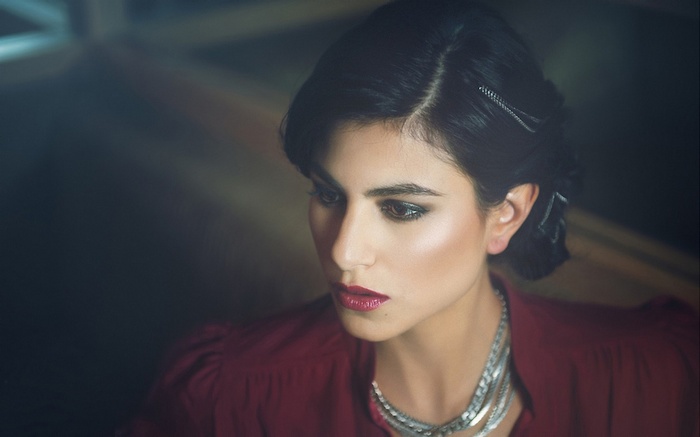 Woman with dark hair and makeup