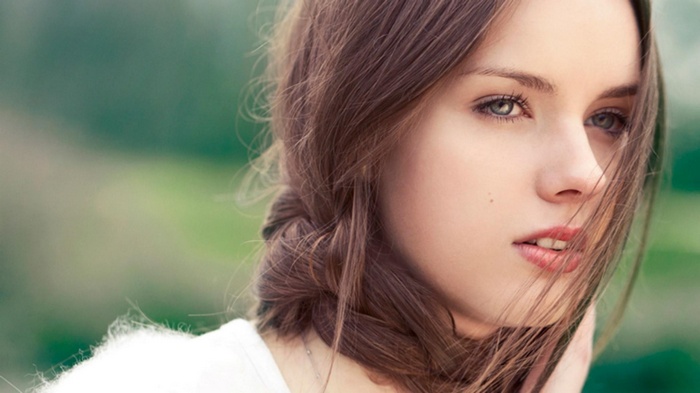 Young woman with braided brown hair