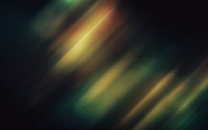 Abstract diagonal light streaks in dark background