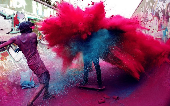 People throwing colorful powder during Holi festival