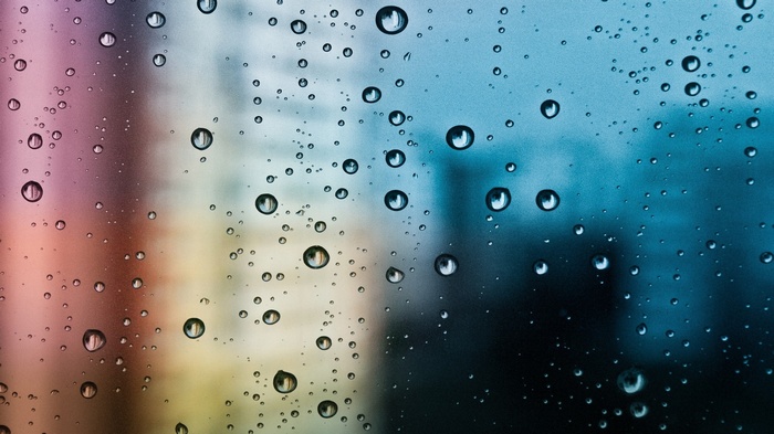 Water drops on glass with colorful background
