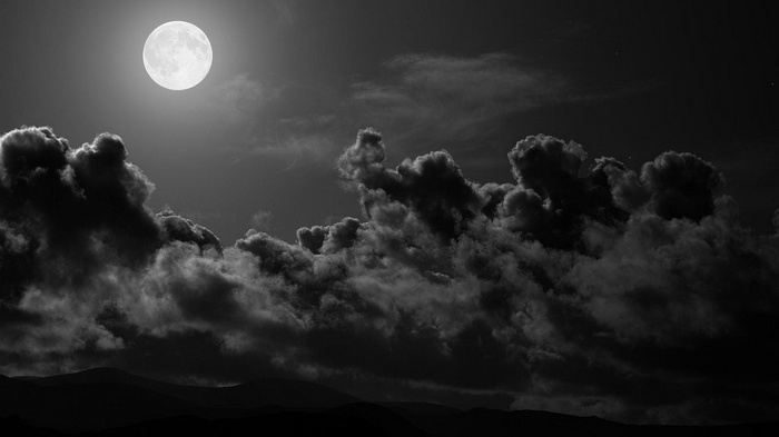 Full Moon and Dark Clouds in the Night Sky