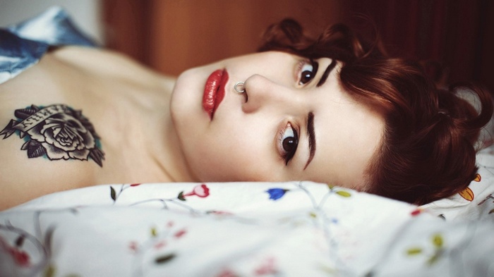 Woman with Rose Tattoo and Nose Piercing