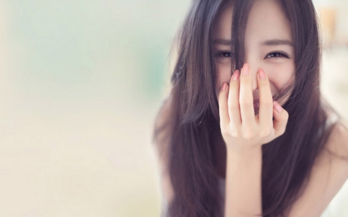 Asian woman with dark hair smiling