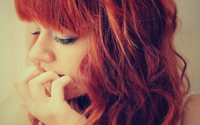 Close-up of a young woman with red hair