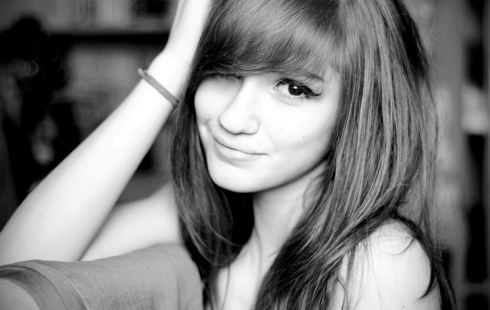 Monochrome portrait of a young woman with long hair