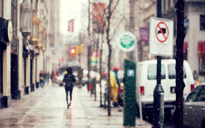 Snowy City Street with Pedestrians and Vehicles
