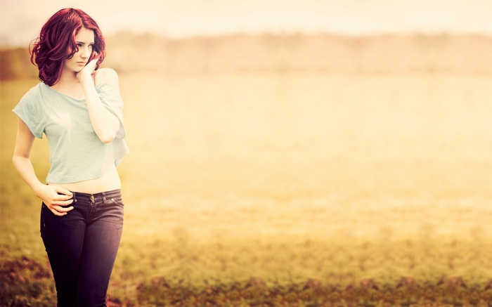 Susan Coffey in a field wearing jeans