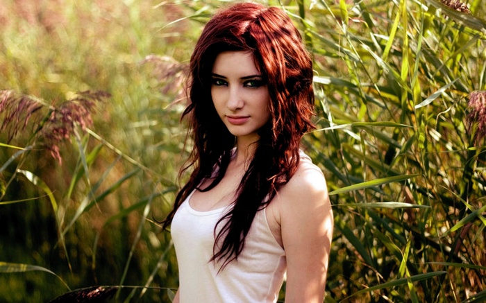 Susan Coffey in a white top outdoors