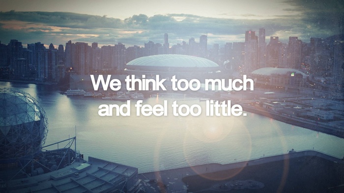 Vancouver skyline with quote "We think too much and feel too little."