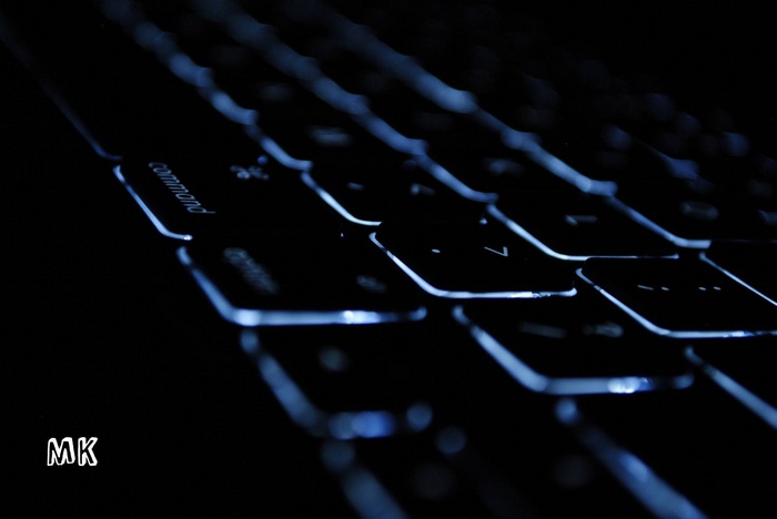 Backlit MacBook keyboard with blue light