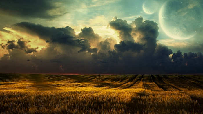 Alien planets and stormy clouds over a golden field
