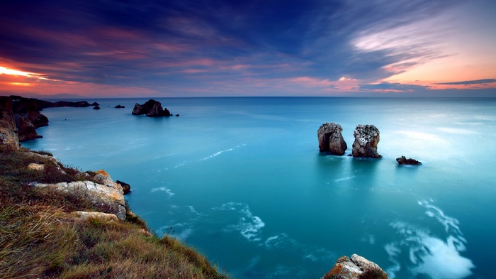 Coastal landscape with rock formations at sunset