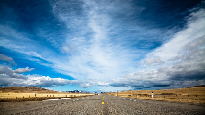 Open road under a dramatic sky