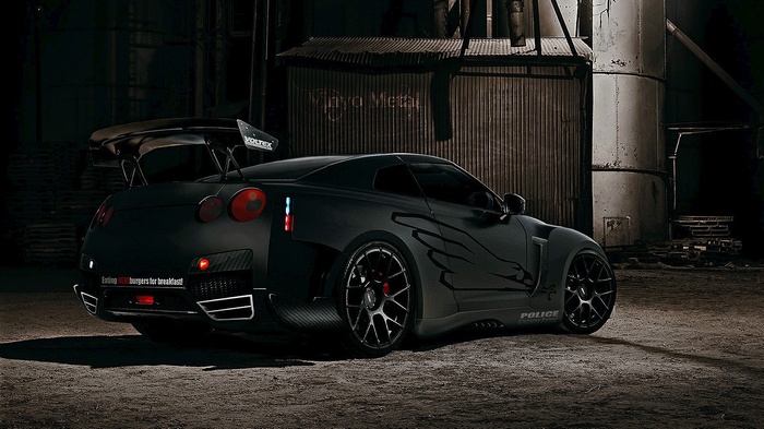 Black Nissan GT-R with custom body kit and decals