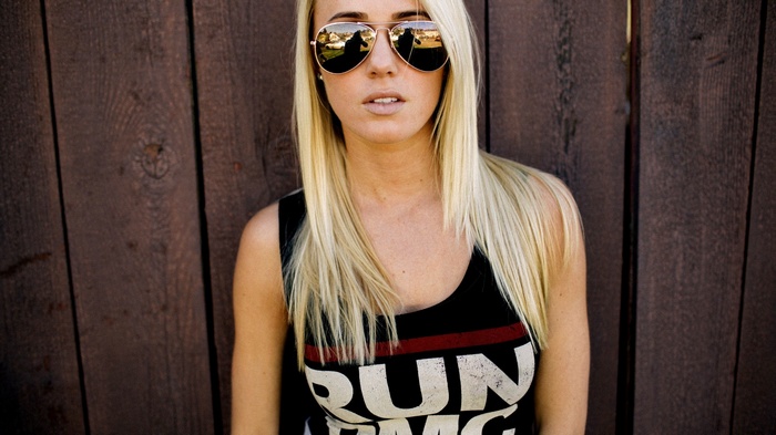 Woman wearing Run DMC shirt and sunglasses