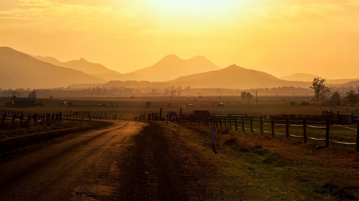 Sunset over a rural landscape with mountains