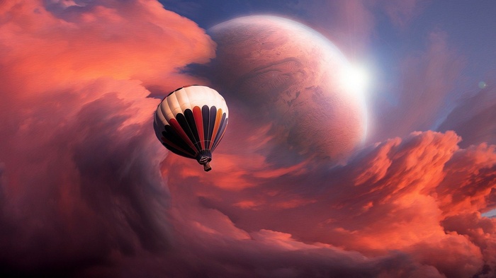 Hot air balloon flying near a planet in colorful clouds