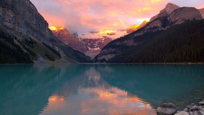 Lake Louise with mountains and sunset