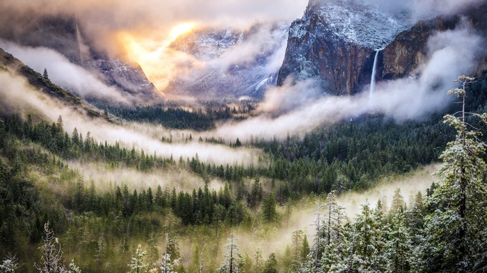 Misty Yosemite Valley with Waterfalls and Sunlight