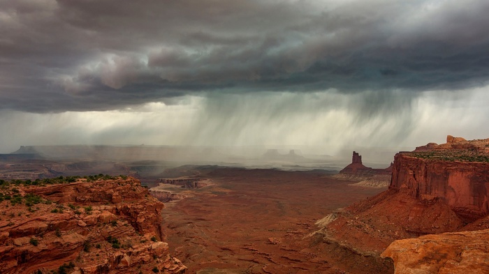 Stormy sky over a desert canyon landscape in the USA