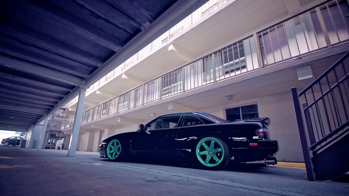 Black Nissan S13 with bright green rims