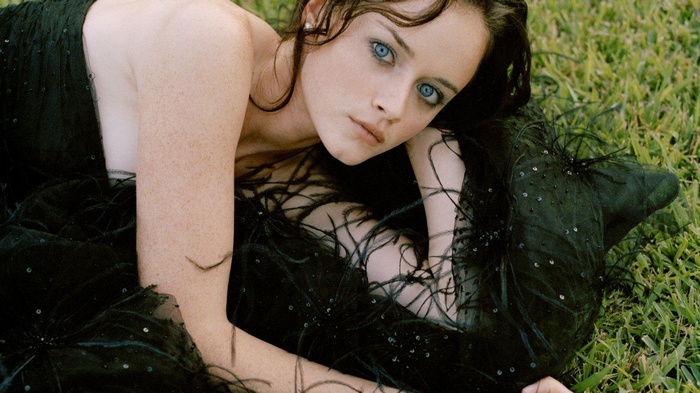 Alexis Bledel in a black dress outdoors