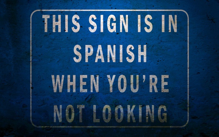 Sign says this sign is in Spanish when you're not looking