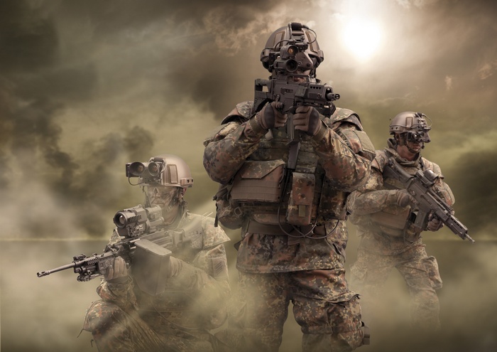 Soldiers with G36 rifles in a dusty environment
