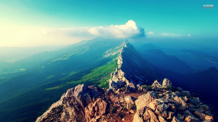 Jagged mountain ridge under a bright blue sky