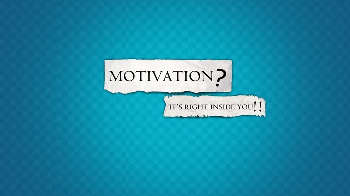 Motivational quote on torn paper