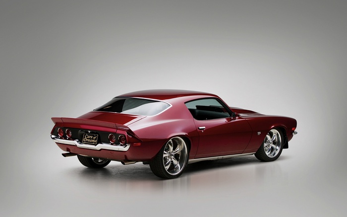 Red Chevrolet Camaro SS parked on a gray background