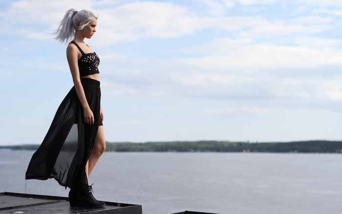 Miranda Hedman on a rooftop overlooking the sea