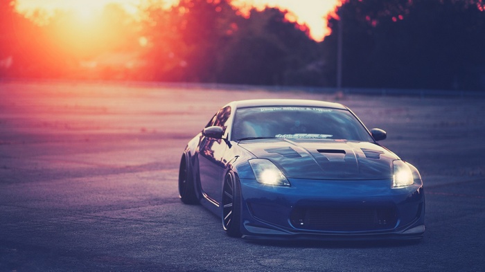 Blue Nissan 350Z sports car at sunset