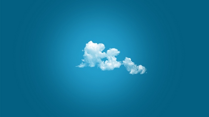 A single cloud against a blue sky