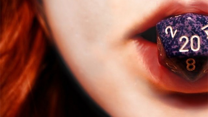 Woman with a D20 die in her mouth