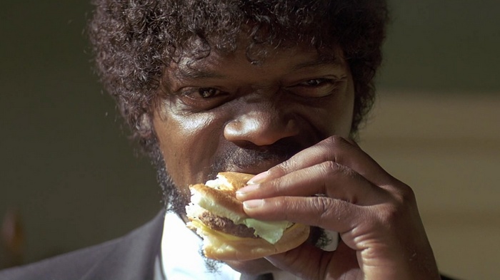 Jules Winnfield eating a burger in Pulp Fiction