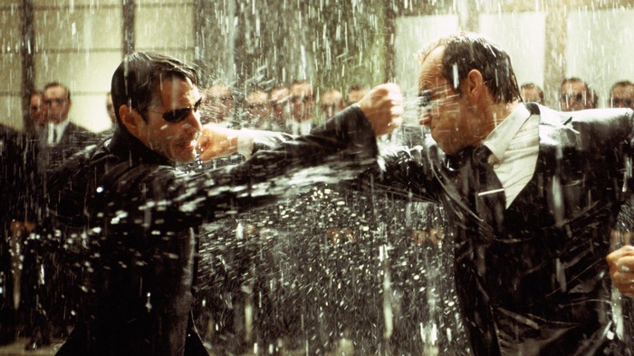 Neo and Agent Smith fighting in the rain