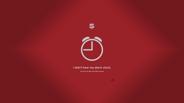 Minimalist alarm clock with text on red background