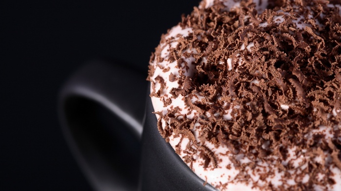 Close-up of a cup of dessert with chocolate shavings