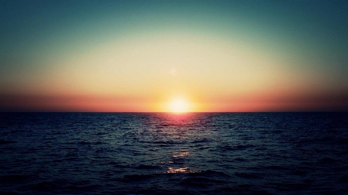 Sunset over the ocean horizon