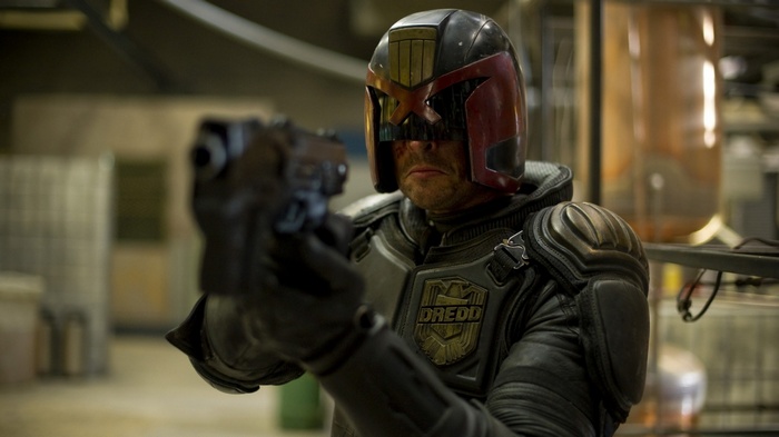 Judge Dredd holding a gun