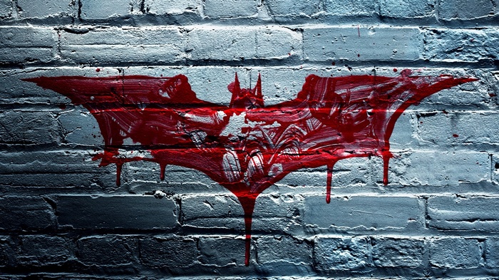 The Dark Knight Batman Logo on Brick Wall