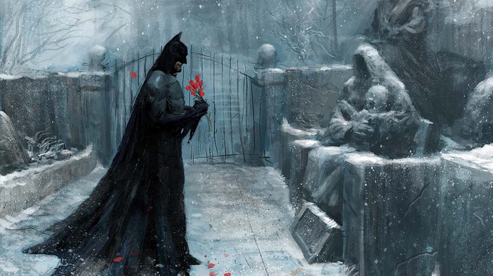Batman holding flowers in a snowy graveyard