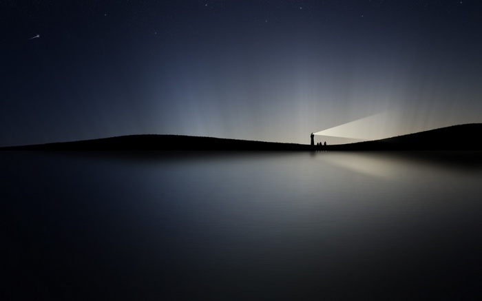 Silhouette of a lighthouse on a hill by the sea at night