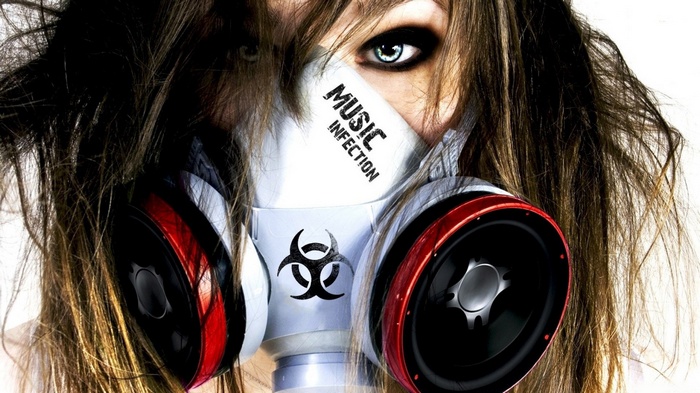 Woman wearing a biohazard gas mask with speakers