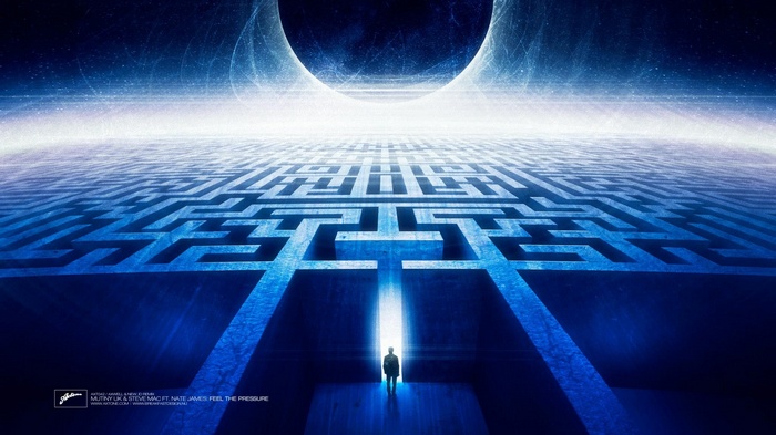 Man standing at the entrance of a glowing maze